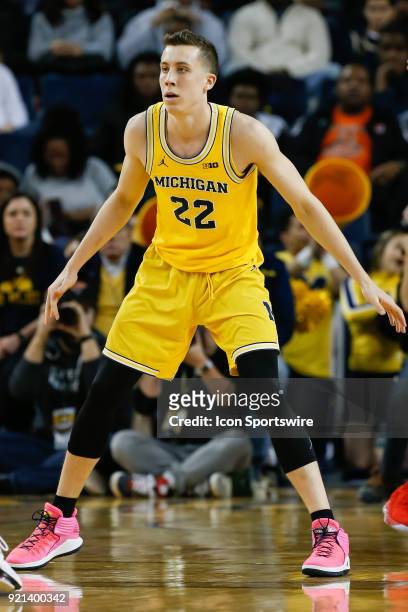 Michigan Wolverines guard Duncan Robinson plays defense during a regular season Big 10 Conference basketball game between the Ohio State Buckeyes and...