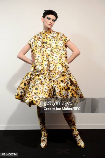 Model backstage ahead of the Richard Quinn show during London Fashion Week February 2018 at BFC Show Space on February 20, 2018 in London, England.