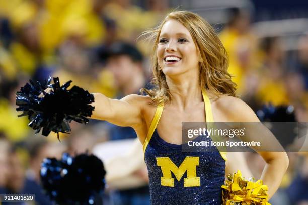 Member of the Michigan dance team performs during a timeout during a regular season Big 10 Conference basketball game between the Ohio State Buckeyes...