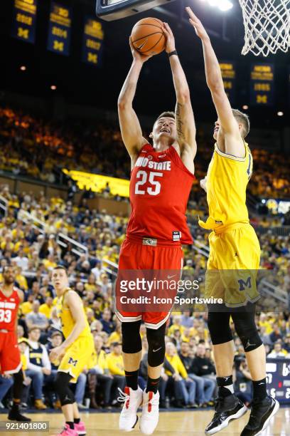 Ohio State Buckeyes forward Kyle Young goes in for a layup against Michigan Wolverines forward Moritz Wagner during a regular season Big 10...