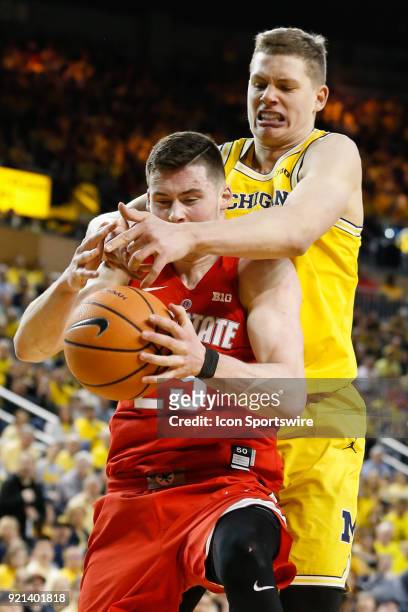 Ohio State Buckeyes forward Kyle Young and Michigan Wolverines forward Moritz Wagner battle to grab a rebound during a regular season Big 10...