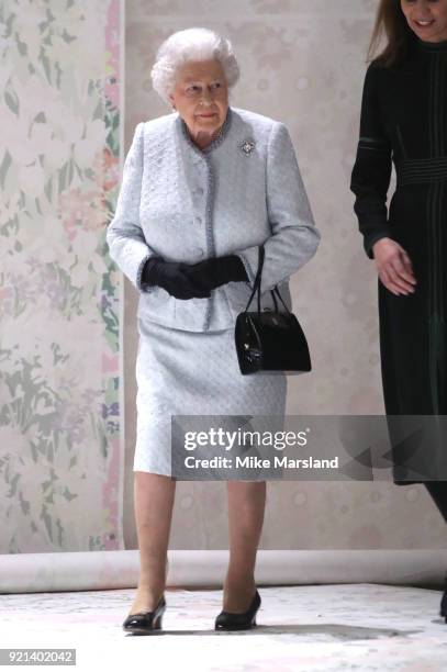 Queen Elizabeth II attends the Richard Quinn show during London Fashion Week February 2018 at BFC Show Space on February 20, 2018 in London, England.