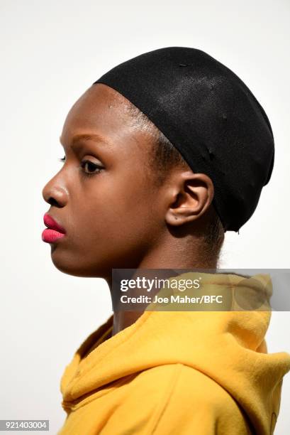 Model backstage ahead of the Richard Quinn show during London Fashion Week February 2018 at BFC Show Space on February 20, 2018 in London, England.