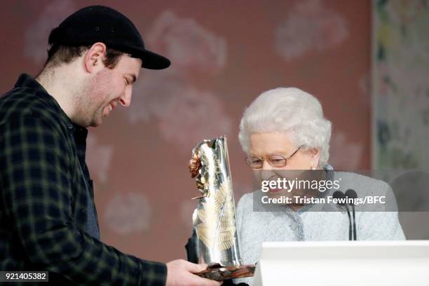 Queen Elizabeth II awards designer Richard Quinn the inaugural Queen Elizabeth II award for British Design during London Fashion Week February 2018...