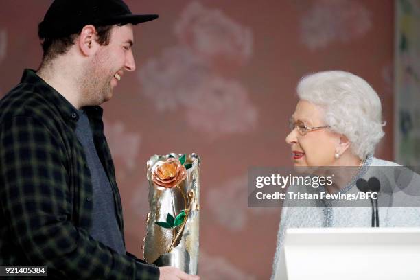 Queen Elizabeth II awards designer Richard Quinn the inaugural Queen Elizabeth II award for British Design during London Fashion Week February 2018...