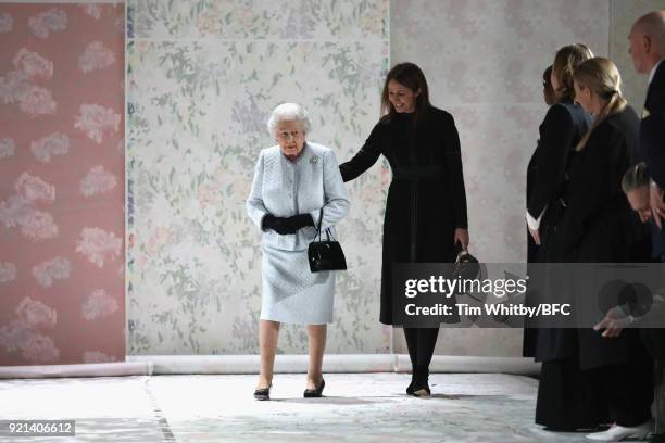 Queen Elizabeth II and Chief Executive of the British Fashion Council Caroline Rush attend the Richard Quinn show during London Fashion Week February...