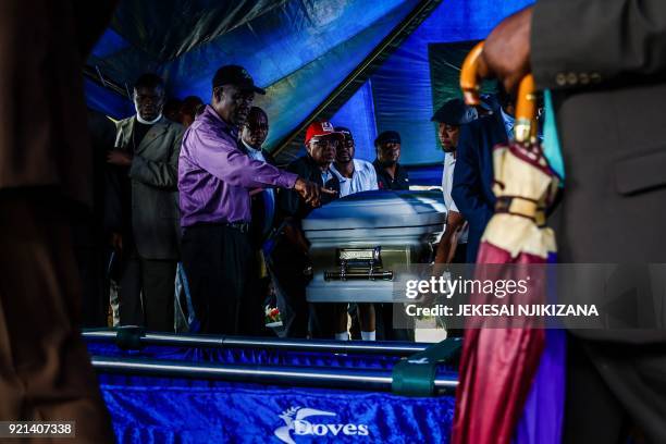 Members of the Movement for Democratic Change party carry the coffin of Zimbabwe's iconic opposition leader Morgan Tsvangirai who died last week...