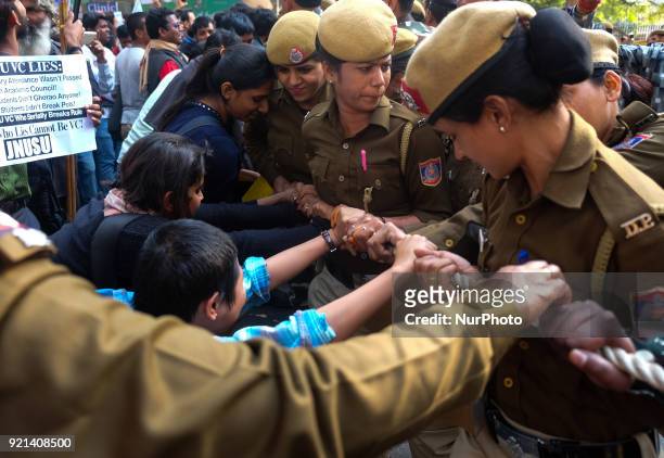 Jawarharlal Nehru University students push against ropes laid by Delhi Police officials to stop the march towards Ministry of Human Resource...