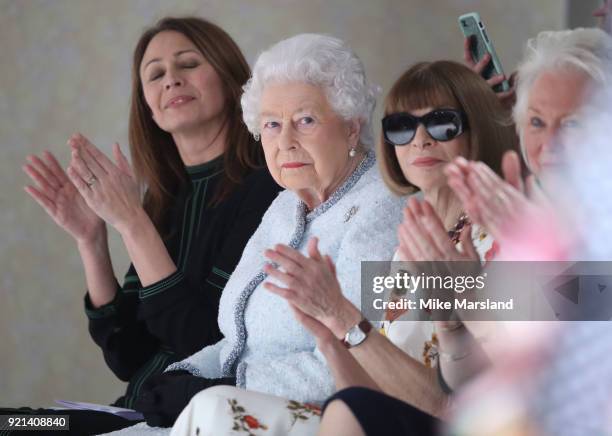 Queen Elizabeth II and Anna Wintour attend the Richard Quinn show during London Fashion Week February 2018 at BFC Show Space on February 20, 2018 in...