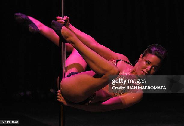 Argentinian pole dancer Natalia Fantino performs in the "Miss Pole Dance Argentina 2009" competition in Buenos Aires, Argentina on October 20, 2009....