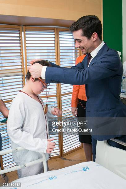 Spanish figure skater Javier Fernandez visits the Gregorio Maranon Hospital to celebrate with children his bronze medal on February 20, 2018 in...