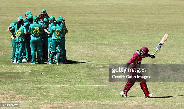 Deandra Dottin from West Indies walks off as South Africa celebrates her wicket during the third one day international Women's cricket match between...