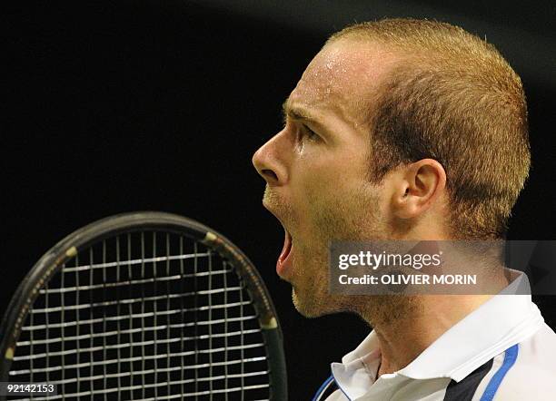 Olivier Rochus of Belgium celebrates his after winning his match against Sweden's Andreas Vinciguerra in Stockholm on October 20 during the second...