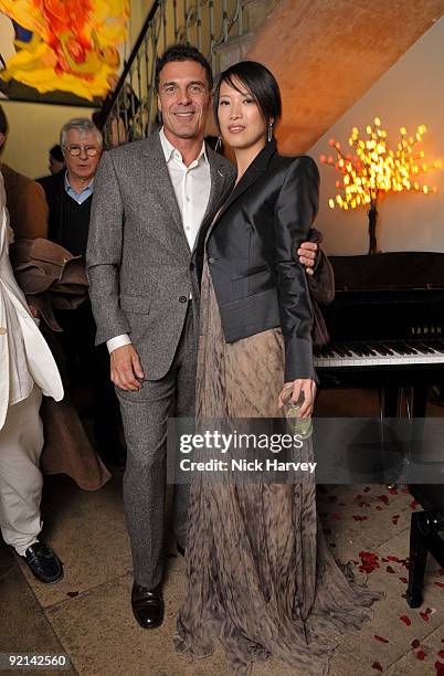 Andre Balazs and Concert pianist Rosey Chan attend the opening night of 'The Embassy' exhibition on October 15, 2009 in London, England.