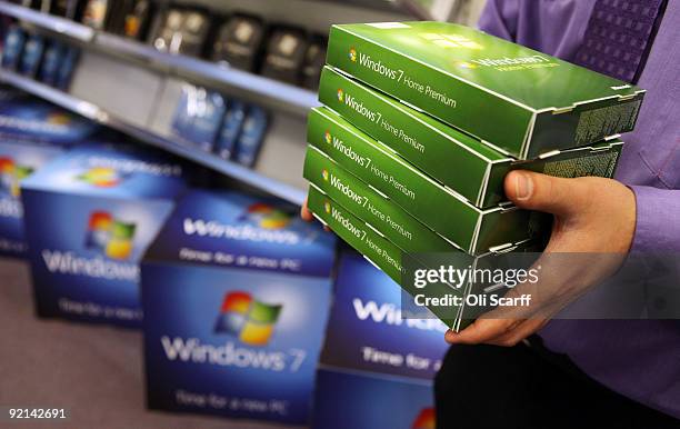 Computer store employee stacks copies of Microsoft's new operating system 'Windows 7' ahead of its official launch at midnight tonight on October 21,...