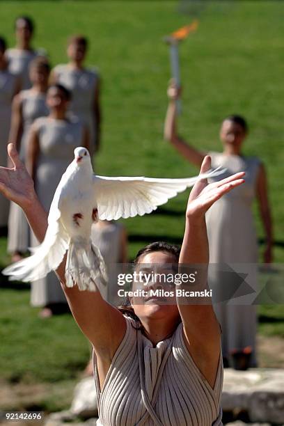 Priestess releases a white dove during a rehearsal for the Lighting Ceremony of the Olympic Flame for the Vancouver 2010 Winter Olympic Games at the...