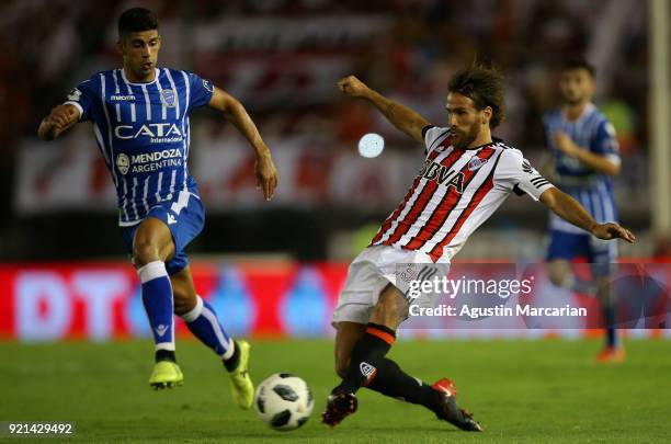 Leonardo Ponzio of River Plate fights for the ball with Angel Gonzalez of Godoy Cruz during a match between River Plate and Godoy Cruz as part of...