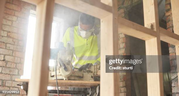 sawing the studding - dust stock pictures, royalty-free photos & images