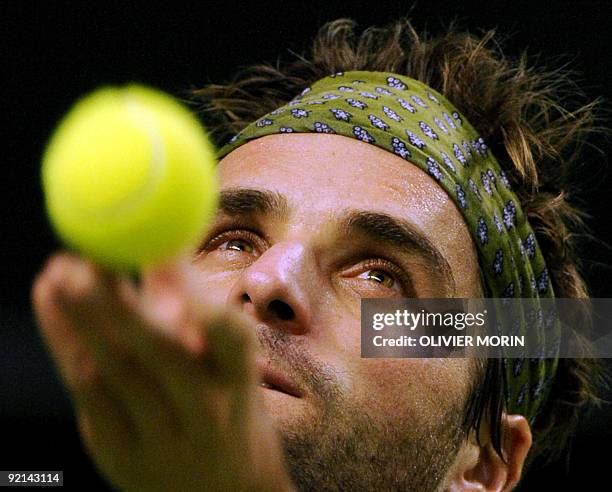 France's Arnaud Clement plays a shot during his match against Germany's Andreas Beck in Stockholm on October 20 on the second day of the Tennis...