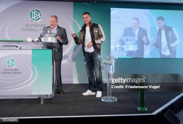 Lukas Podolski of FC Koeln and DFB spokesman Harald Stenger draw the Women's DFB Cup round of sixteen matches during the DFB press conference for the...