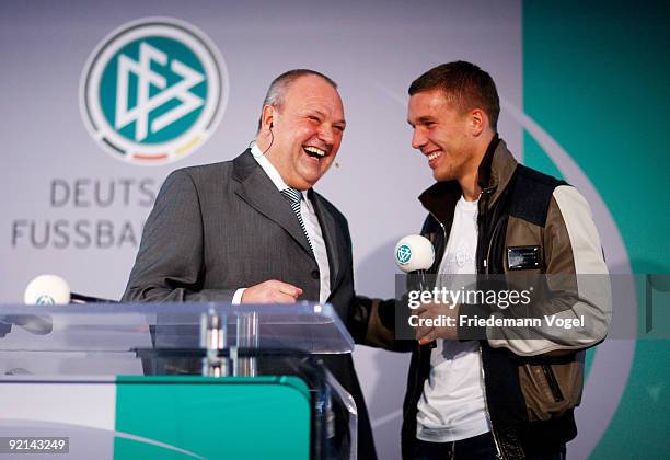 Lukas Podolski of FC Koeln and DFB spokesman Harald Stenger laugh drawing the Women's DFB Cup round of sixteen matches during the DFB press...