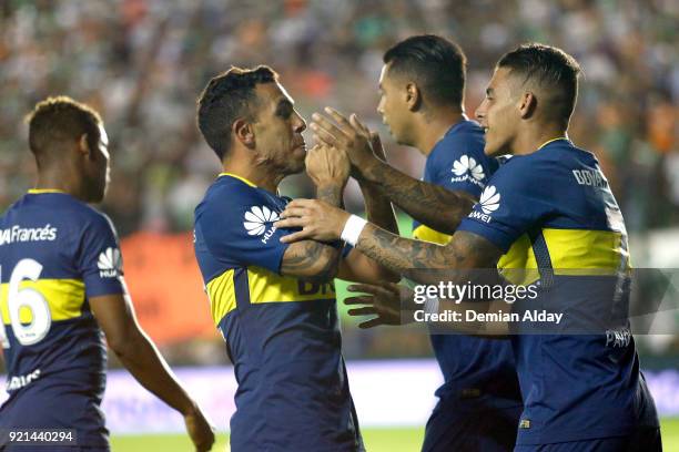 Carlos Tevez of Boca Juniors celebrates with teammates after scoring the first goal of his team during a match between Banfield and Boca Juniors as...