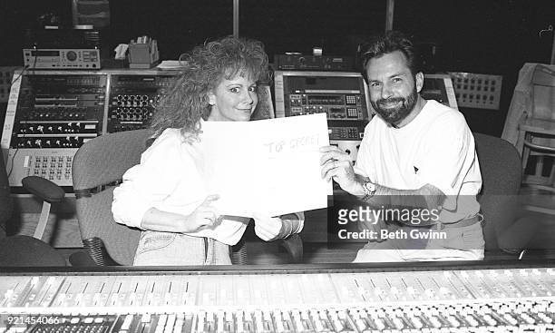 Country singer and songwriter Reba McEntire and Tony Brown in the studio on August 8, 1991 in Nashville, Tennessee.