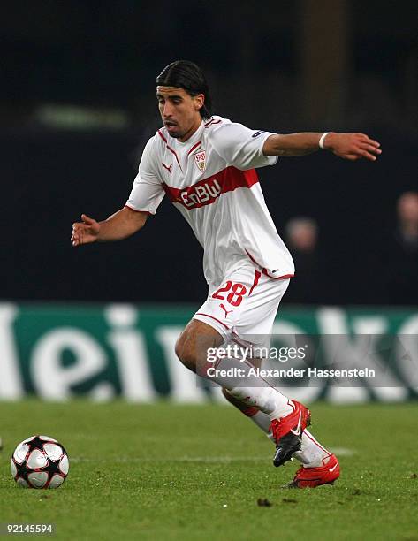 Sami Khedira of Stuttgart runs with the ball during the UEFA Champions League Group G match between VfB Stuttgart and Sevilla FC at the Mercedes-Benz...