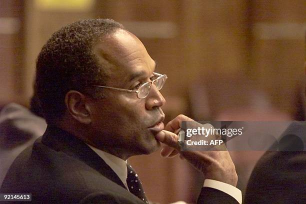 Simpson looks on during jury selection of his trial at the Miami circuit court 09 October 2001 in Miami, Florida. Simpson is on trial for an incident...