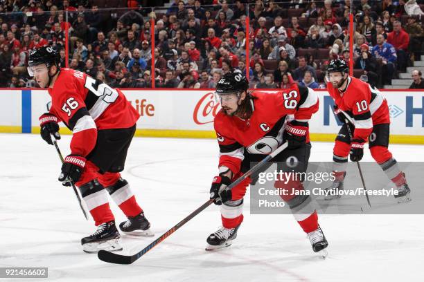 Teammates Magnus Paajarvi, Erik Karlsson and Tom Pyatt of the Ottawa Senators prepares for a faceoff against the New York Rangers at Canadian Tire...