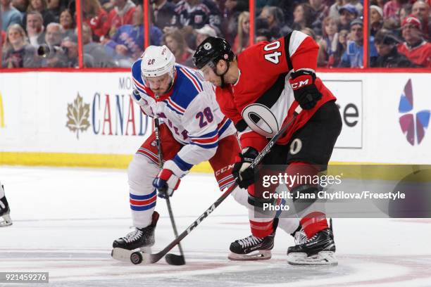 Gabriel Dumont of the Ottawa Senators takes a face-off against Paul Carey of the New York Rangers at Canadian Tire Centre on February 17, 2018 in...