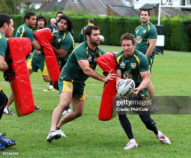 Kurt Gidley of the VB Kangaroos, Australian Rugby league Team gets tackled by teammate Cameron Smith during a training session at St Paul's School,...