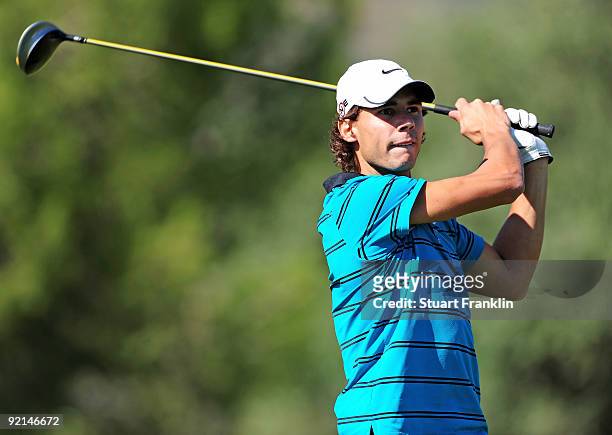 Tennis player Rafael Nadal of Spain plays a tee shot during the Pro - Am of the Castello Masters Costa Azahar at the Club de Campo del Mediterraneo...