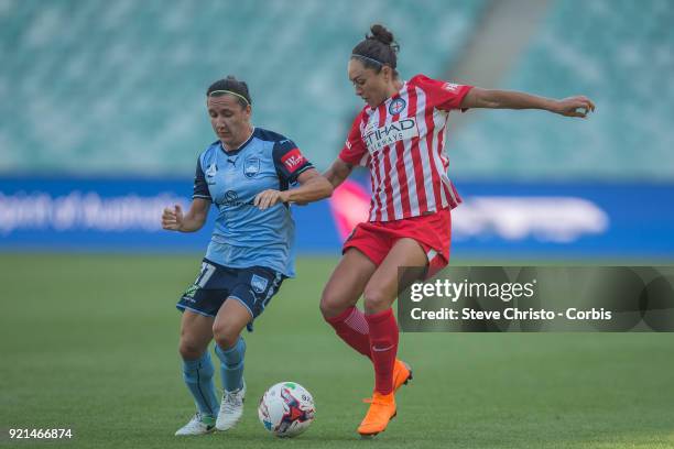 Kyah Simon of the Melbourne City is challenged for the ball by Sydney's Lisa De Vanna during the W-League Grand Final match between the Sydney FC and...