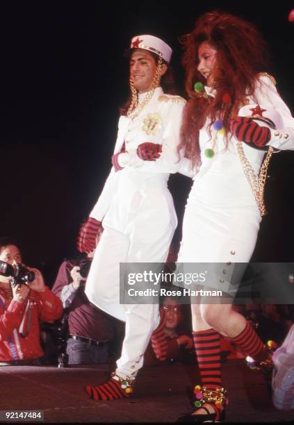 Designer Marc Jacobs and author Tama Janowitz walk the runway during the Betsey Johnson show, New York, ca. 1990s.