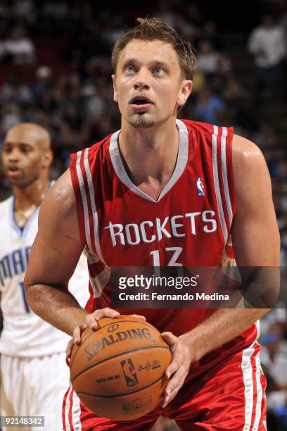 David Andersen of the Houston Rockets shoots a free throw during the preseason game against the Orlando Magic on October 9, 2009 at Amway Arena in...