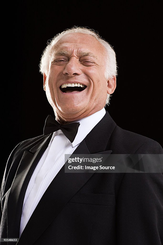 Laughing man in a dinner jacket