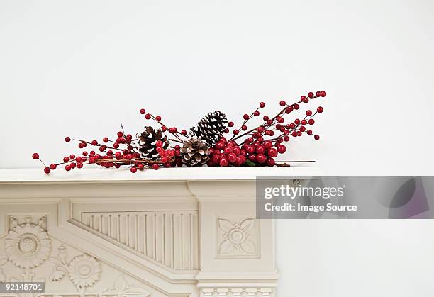 festive display on mantlepiece - mantelpiece stock pictures, royalty-free photos & images