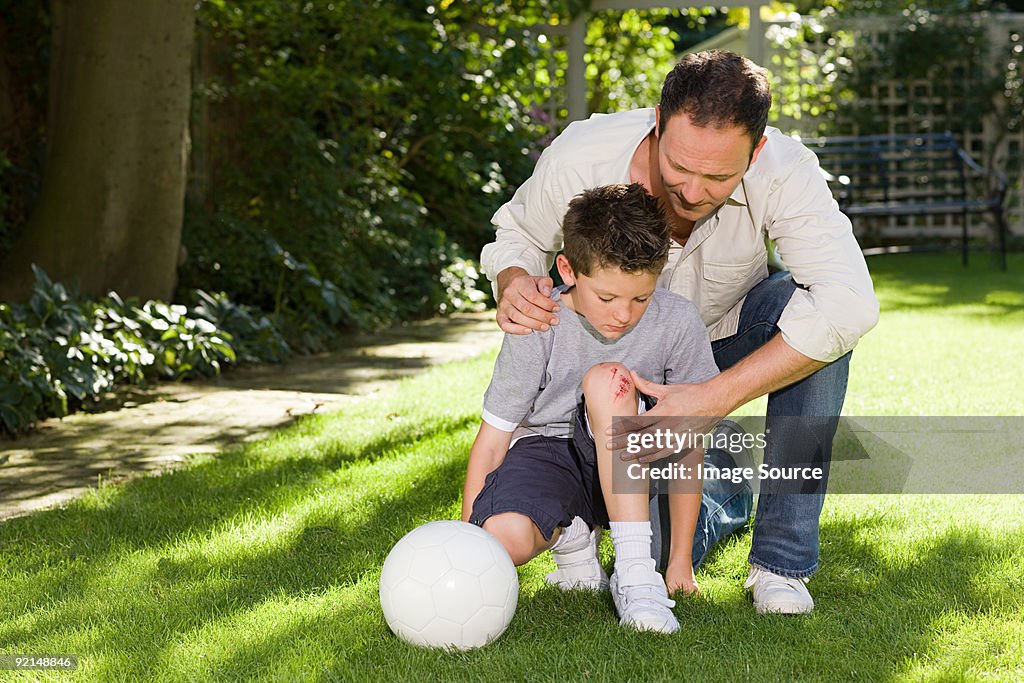 Father and son with a grazed knee