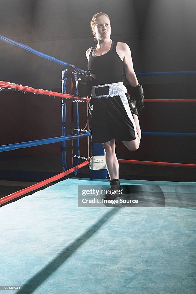 Female boxer in boxing ring
