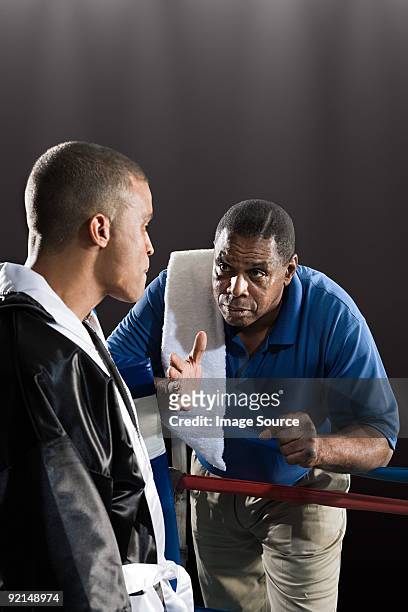 boxer and coach - boxing coach stock pictures, royalty-free photos & images