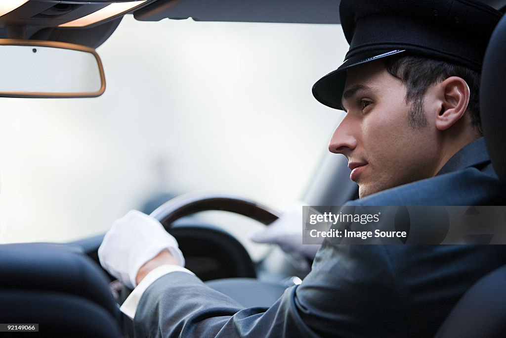 Male chauffeur driving