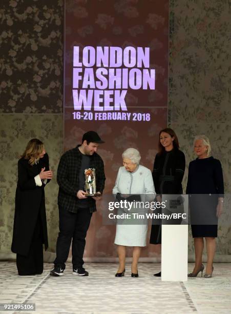 Queen Elizabeth II awards designer Richard Quinn the inaugural Queen Elizabeth II award for British Design alongside Chief Executive of the British...