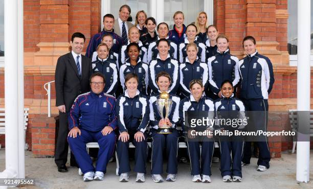England Women's captain Charlotte Edwards holds the World Cup trophy with the rest of the England team and Secretary of State for Culture, Media and...