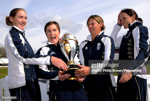 England cricketers Beth Morgan, Claire Taylor, Nicky Shaw and Caroline Atkins with the ICC Women's World Cup trophy at Lord's Cricket Ground, London,...