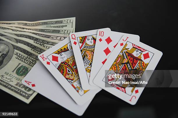 royal flush in diamond and dollars in studio - ace of diamonds stock pictures, royalty-free photos & images