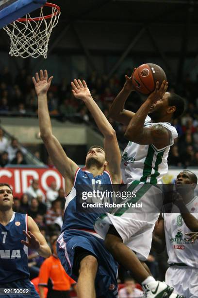 Luksa Andric, #12 of Cibona competes with Terrell McIntyre, #5 of Montepaschi Siena during the Euroleague Basketball Regular Season Game Day 1 match...