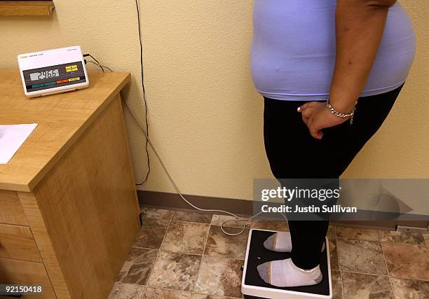 Seventeen year-old Marissa Hamilton stands on a scale during her weekly weigh-in at the Wellspring Academy October 21, 2009 in Reedley, California....