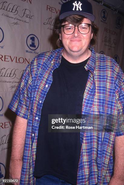 Film director Michael Moore, wearing a New York Yankees baseball hat, attends the VH1 Awards in New York, 1998.
