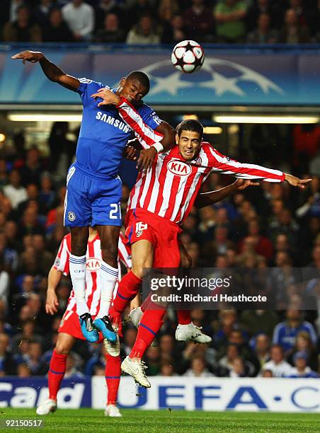 Salomon Kalou of Chelsea outjumps Alvaro Dominguez of Atletico Madrid during the UEFA Champions League Group D match between Chelsea and Atletico...